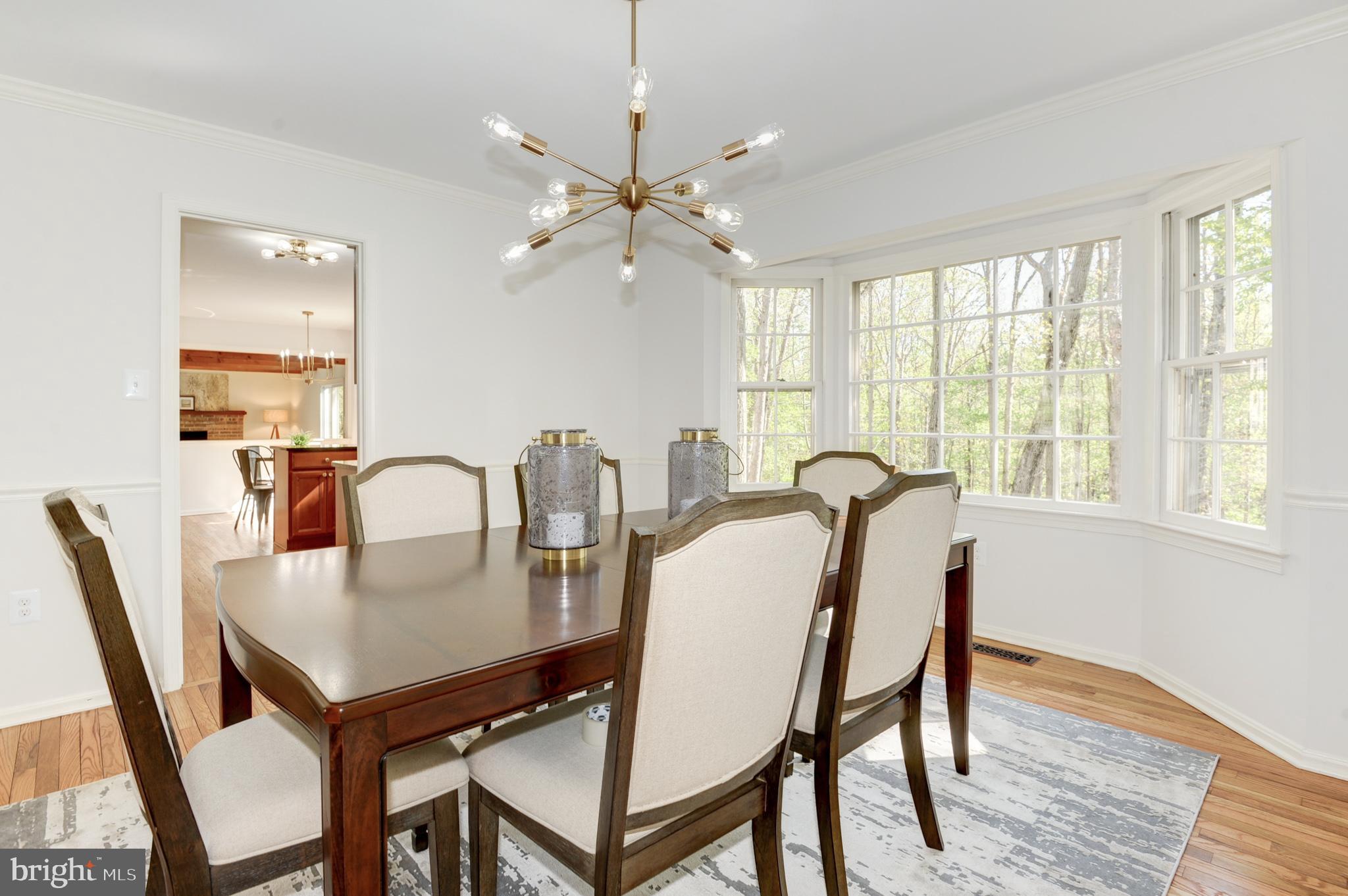 10809 Cross School Road Reston, VA 20191 - Photo 29 of 60 a view of a a dining room with furniture window and wooden floor
