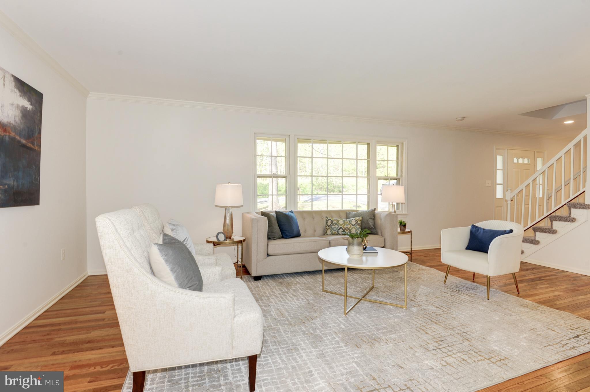 10809 Cross School Road Reston, VA 20191 - Photo 31 of 60 a living room with furniture and a large window