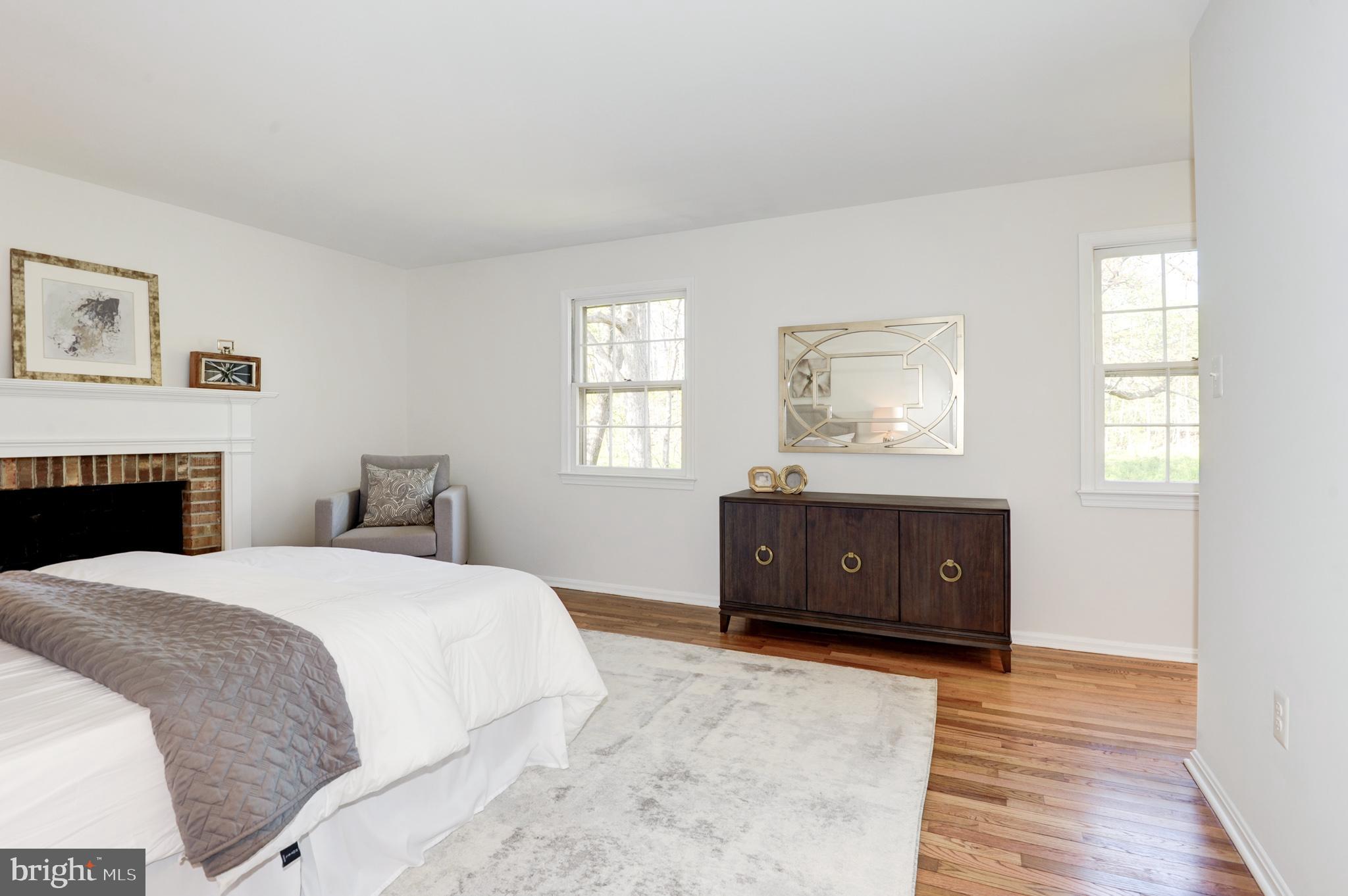 10809 Cross School Road Reston, VA 20191 - Photo 36 of 60 a bedroom with a bed and a window