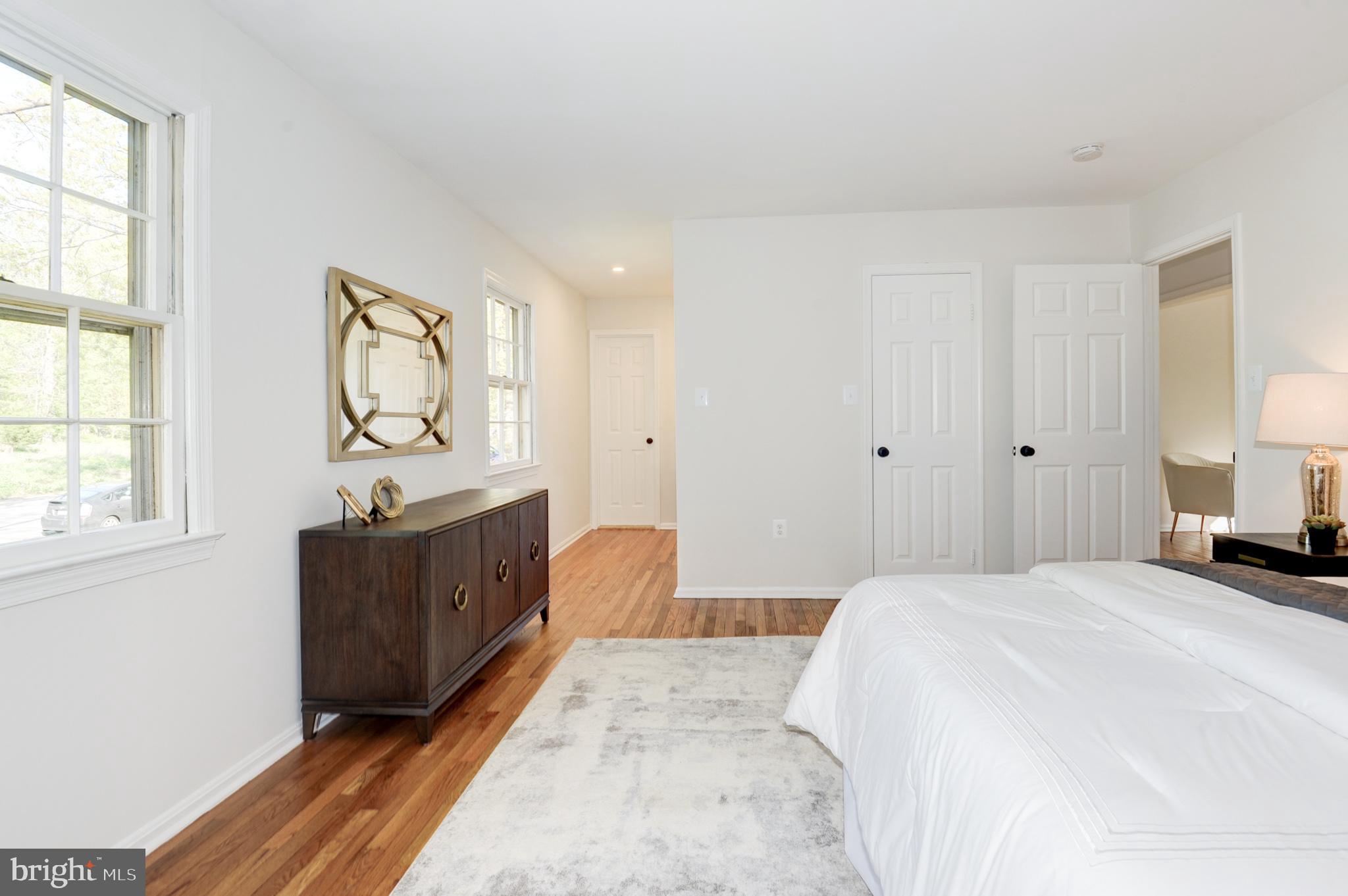 10809 Cross School Road Reston, VA 20191 - Photo 38 of 60 a bedroom with a bed and a dresser