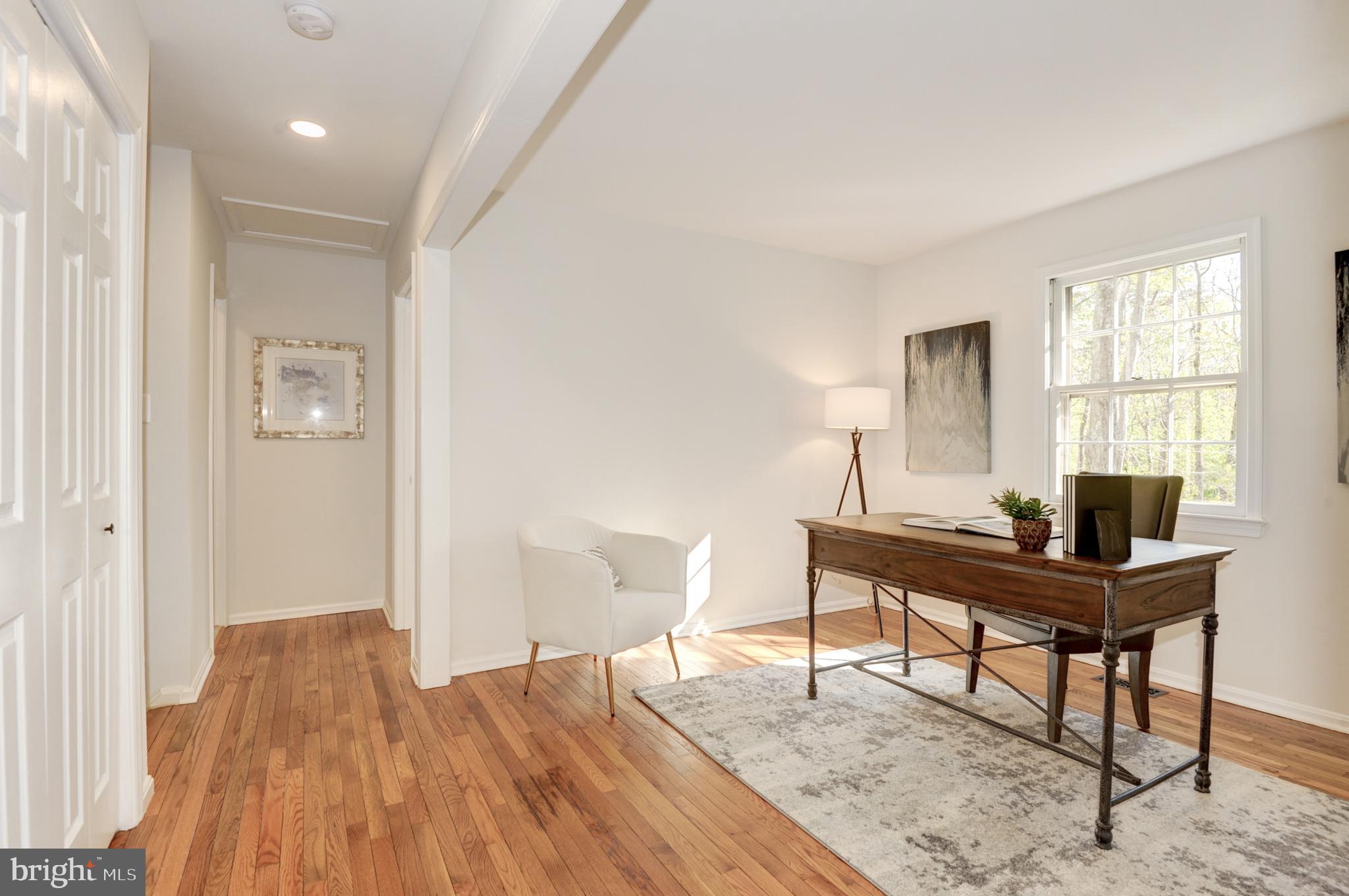 10809 Cross School Road Reston, VA 20191 - Photo 44 of 60 a view of a workspace with furniture and a window