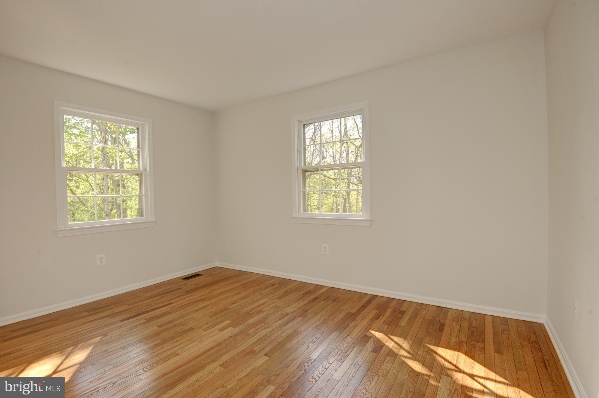 10809 Cross School Road Reston, VA 20191 - Photo 51 of 60 a view of a room with wooden floor and windows