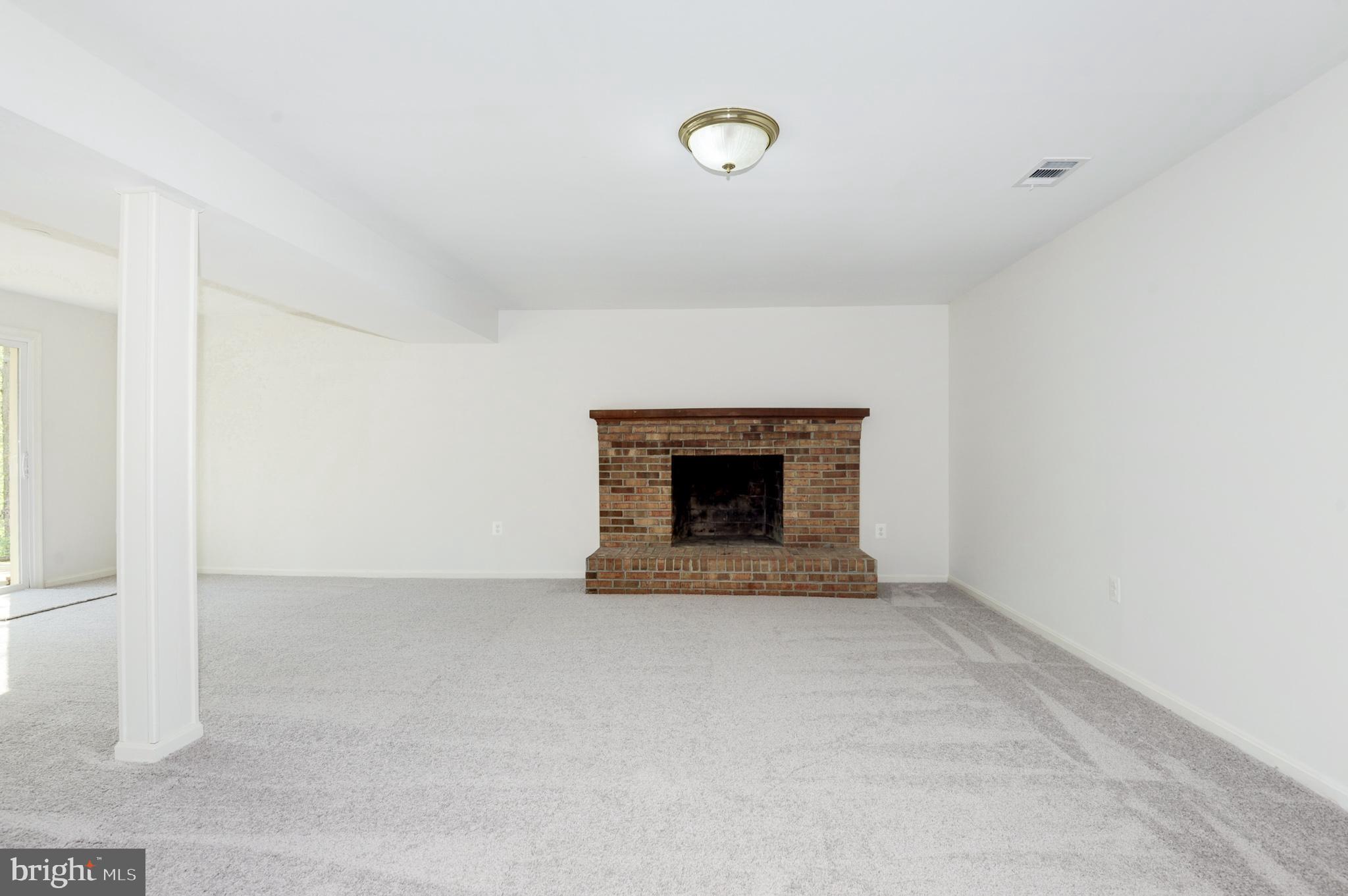 10809 Cross School Road Reston, VA 20191 - Photo 55 of 60 a view of an empty room with a fireplace