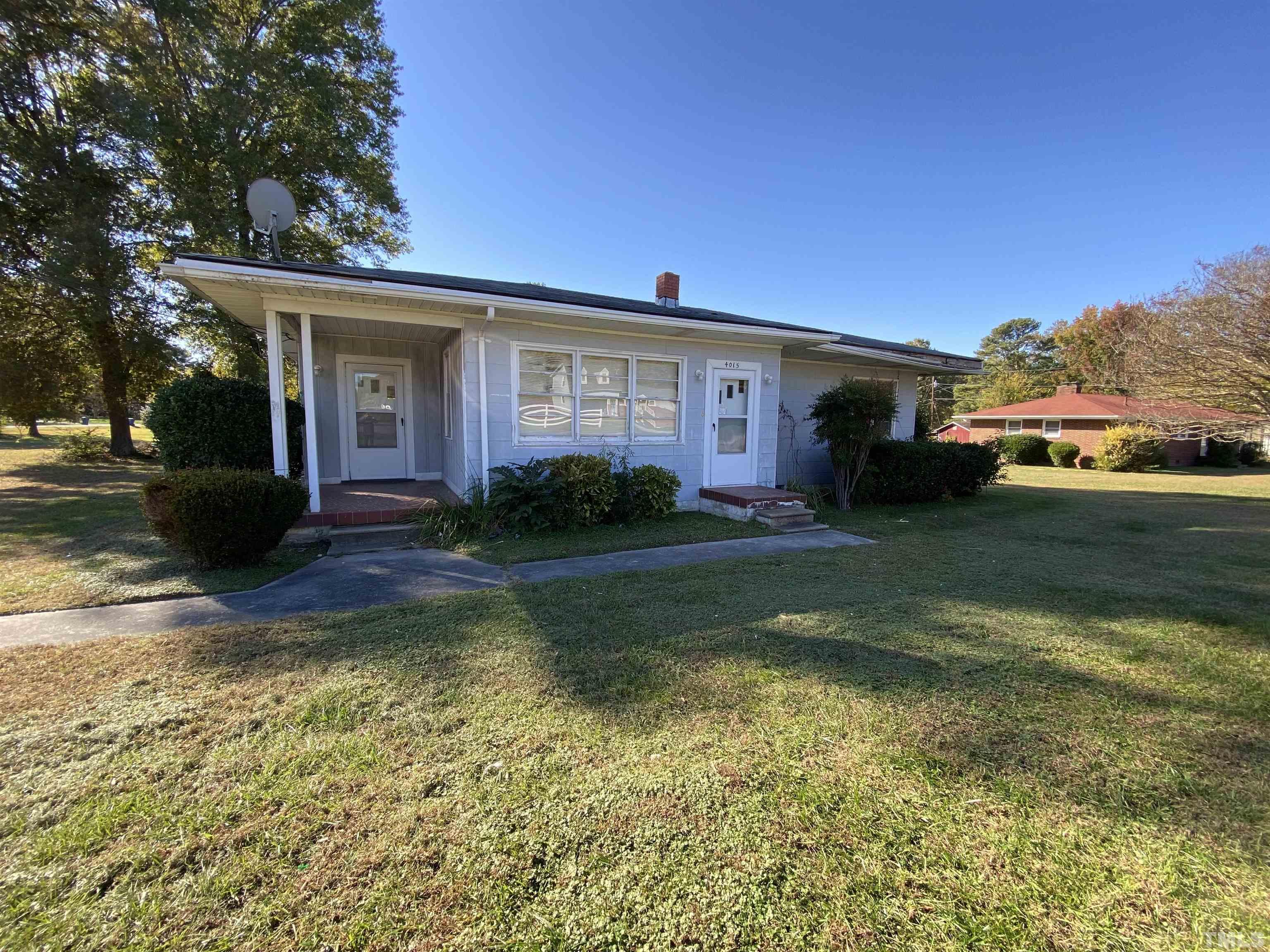 4015 St James Church Road Raleigh, NC 27604 - Photo 2 of 13 a view of a house with a garden