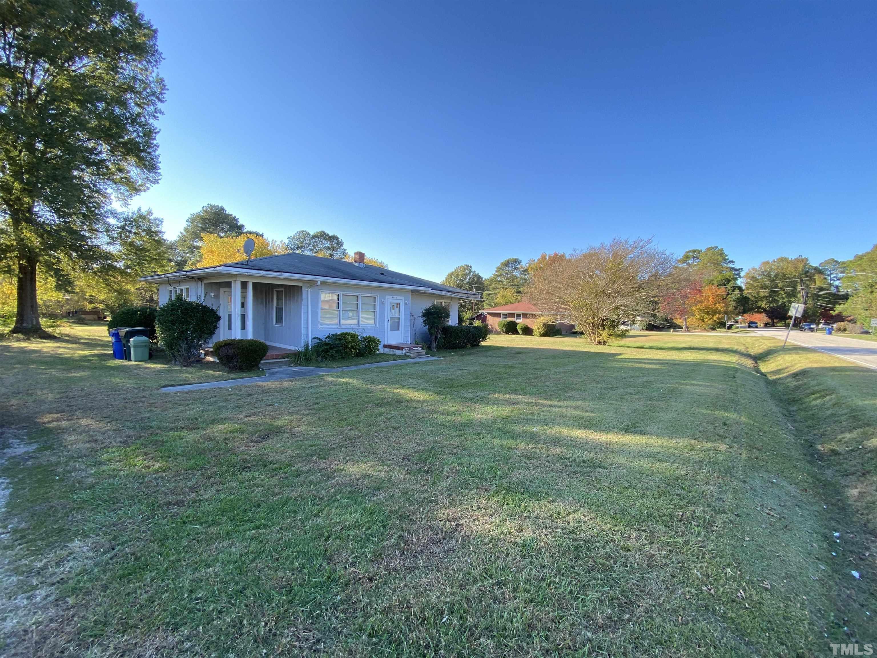 4015 St James Church Road Raleigh, NC 27604 - Photo 4 of 13 a view of a house with a yard