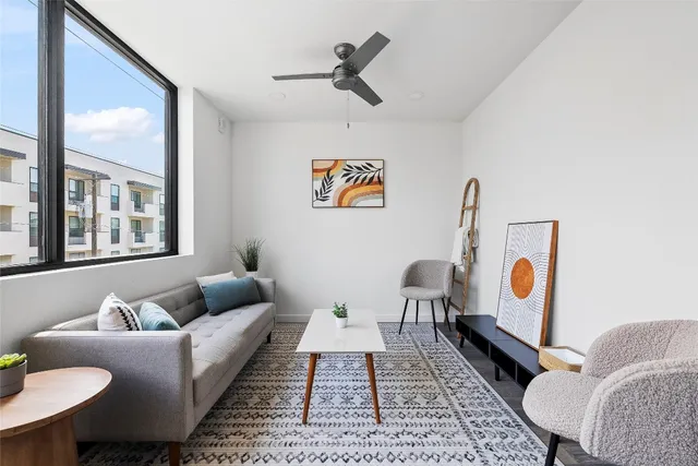 a living room with furniture and rug