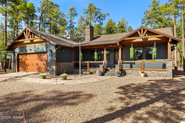 a front view of a house with a outdoor space