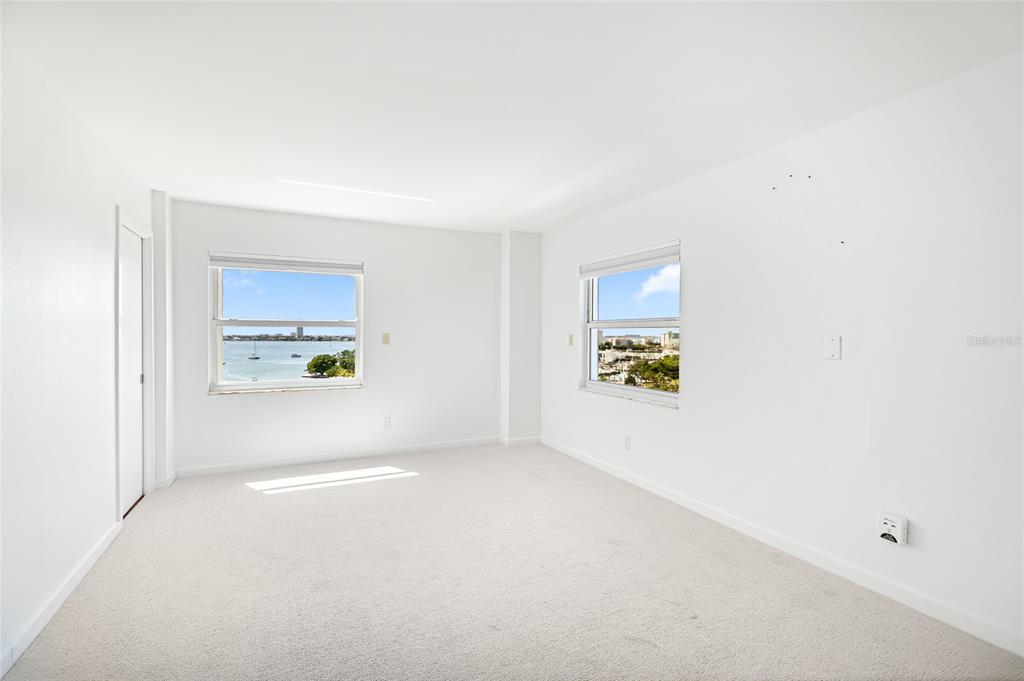 435 South Gulfstream Avenue, Unit 1004 Sarasota, FL 34236 - Photo 13 of 37 a view of an empty room with a window