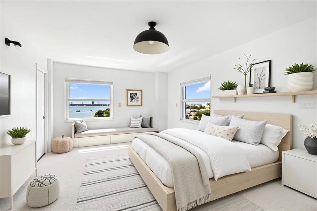 435 South Gulfstream Avenue, Unit 1004 Sarasota, FL 34236 - Photo 14 of 37 a bedroom with a bed and ceiling fan