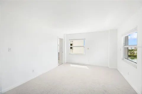 a bathroom with a toilet a sink and shower