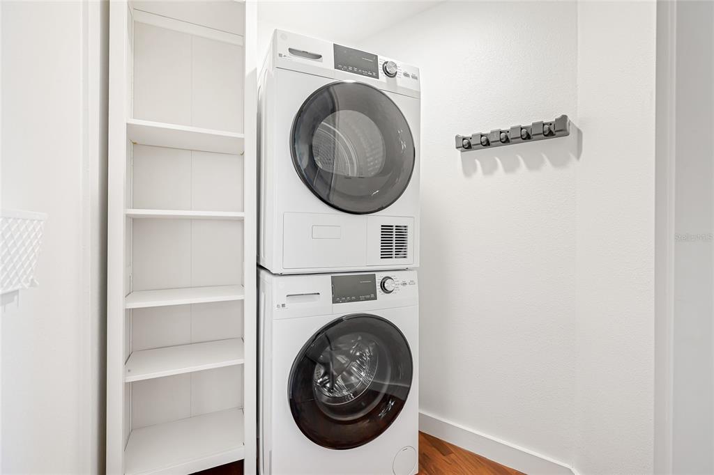 435 South Gulfstream Avenue, Unit 1004 Sarasota, FL 34236 - Photo 26 of 37 a utility room with dryer and washer