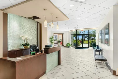 a view of a dining room with furniture and window