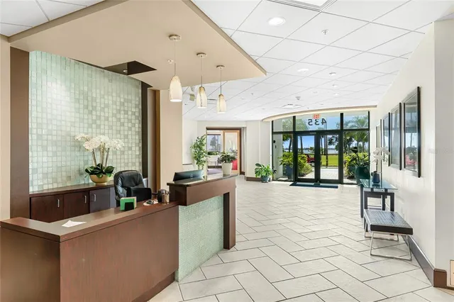 a view of a dining room with furniture and window