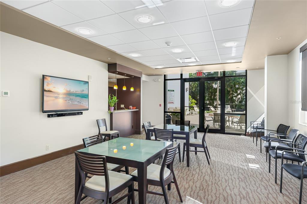 435 South Gulfstream Avenue, Unit 1004 Sarasota, FL 34236 - Photo 29 of 37 a view of a dining room with furniture window and outside view
