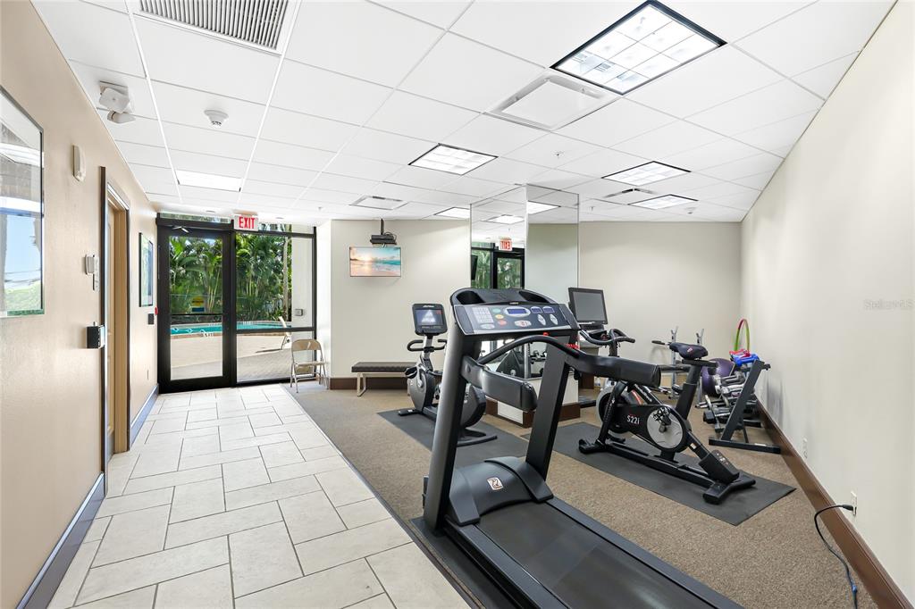 435 South Gulfstream Avenue, Unit 1004 Sarasota, FL 34236 - Photo 34 of 37 a view of a patio with table and chairs
