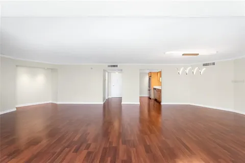 a living room with furniture a rug and a window