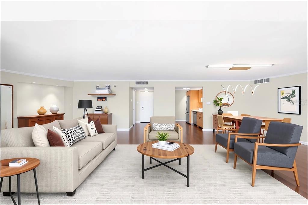435 South Gulfstream Avenue, Unit 1004 Sarasota, FL 34236 - Photo 9 of 37 a living room with furniture a rug and a window