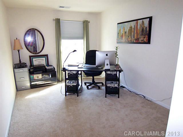 113 Inlet Point Drive, Unit 78 Tega Cay, SC 29708 - Photo 15 of 16 a view of a workspace with a window and workspace