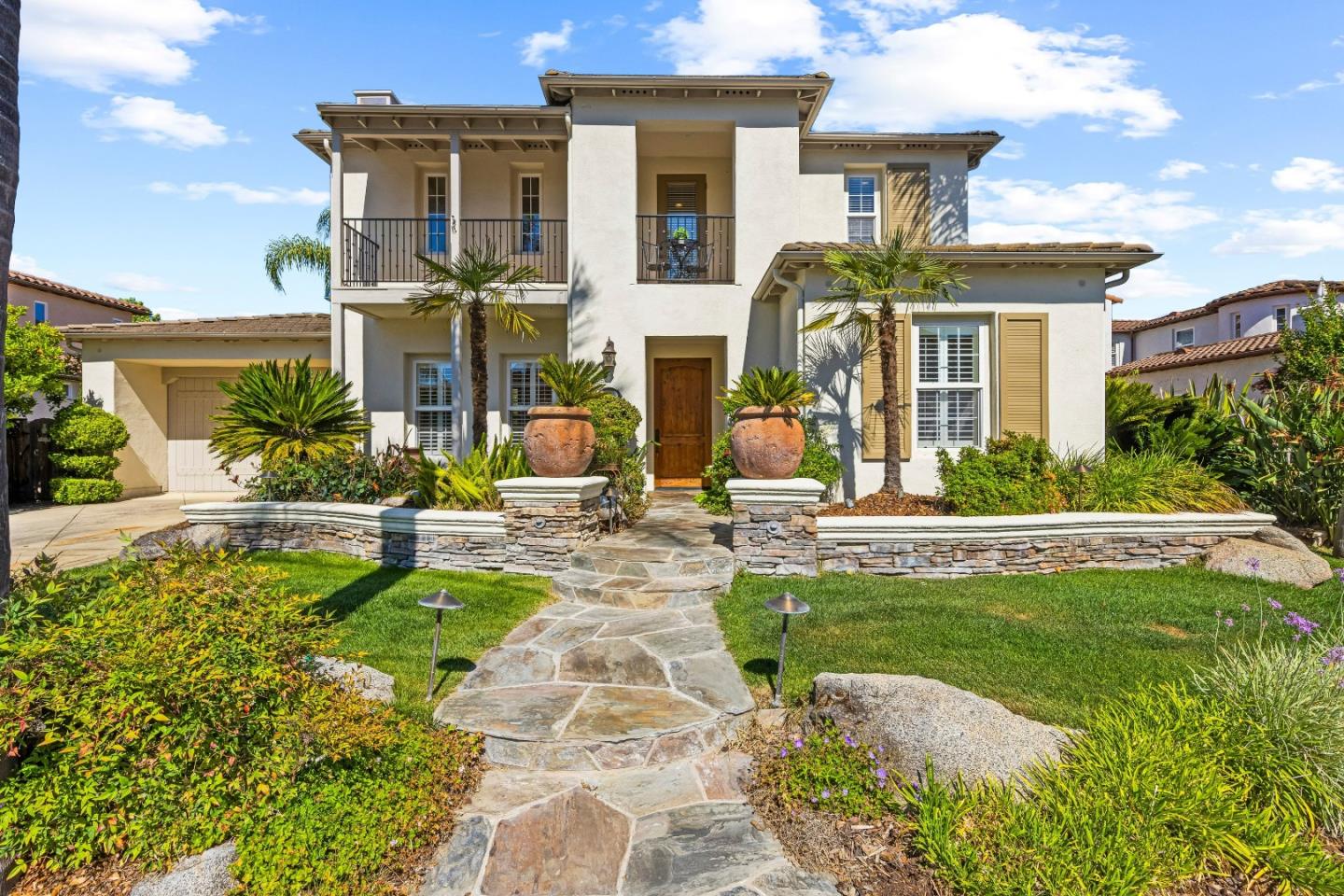 7466 Dunbar Court Gilroy, CA 95020 - Photo 4 of 103 a front view of a house with swimming pool having outdoor seating