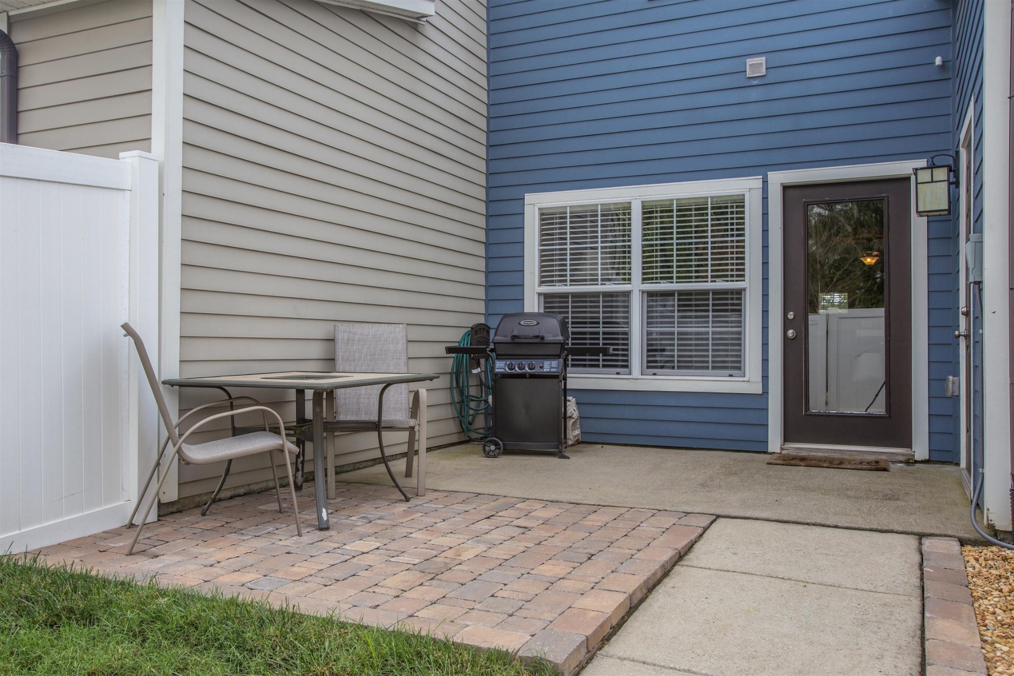 2015 Hemlock Drive Spring Hill, TN 37174 - Photo 16 of 22 a view of a backyard with chairs and table in a patio