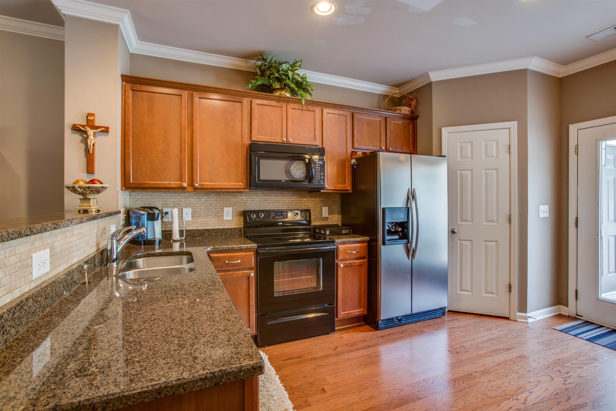 2015 Hemlock Drive Spring Hill, TN 37174 - Photo 6 of 22 a kitchen with granite countertop a refrigerator stove and oven