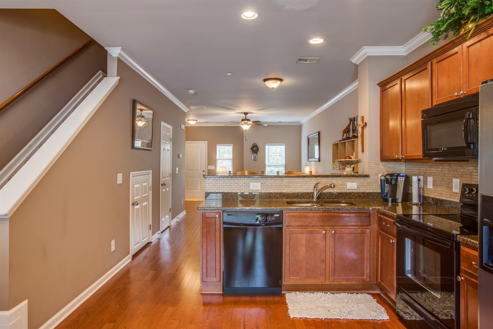 2015 Hemlock Drive Spring Hill, TN 37174 - Photo 8 of 22 a kitchen with stainless steel appliances granite countertop wooden cabinets a stove top oven a sink and dishwasher