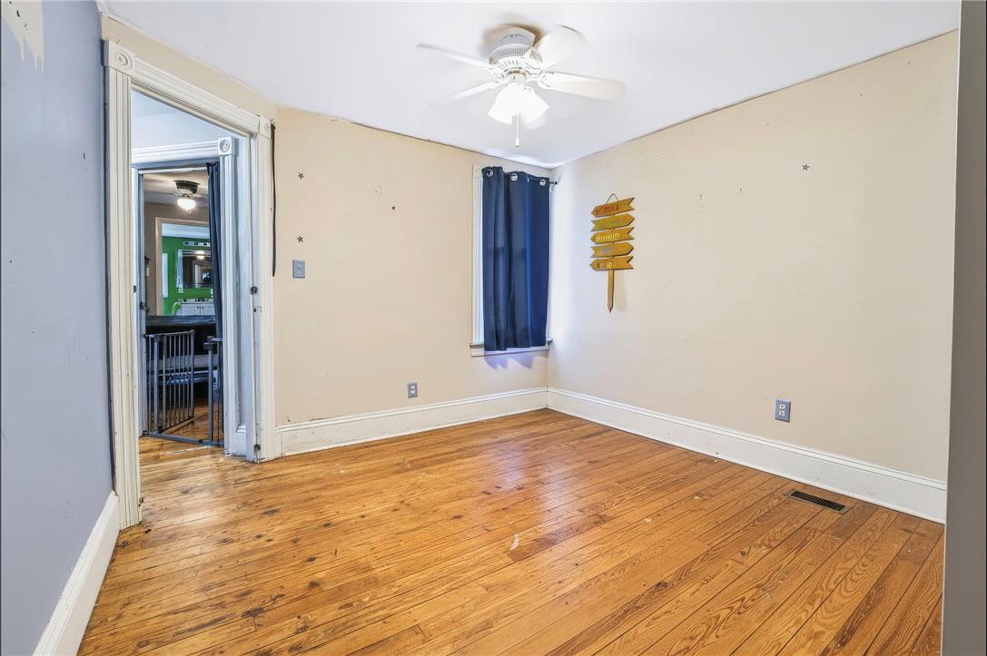 1030 Monocacy Street Bethlehem, PA 18018 - Photo 18 of 34 Rich hardwood floors and classic tall baseboards bring historic charm to this versatile room.
