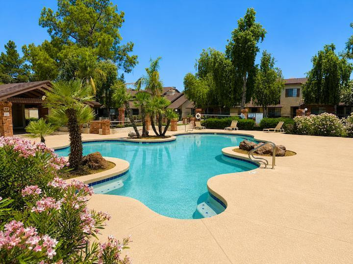 170 East Guadalupe Road, Unit 62 Gilbert, AZ 85234 - Photo 11 of 12 front view of a house with swimming pool and porch