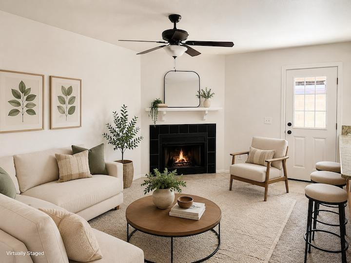 170 East Guadalupe Road, Unit 62 Gilbert, AZ 85234 - Photo 2 of 12 a living room with furniture a fireplace and a table