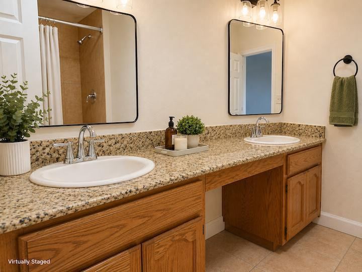 170 East Guadalupe Road, Unit 62 Gilbert, AZ 85234 - Photo 6 of 12 a bathroom with a granite countertop sink and a mirror