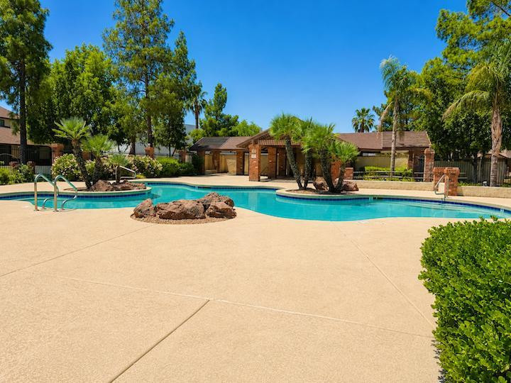 170 East Guadalupe Road, Unit 62 Gilbert, AZ 85234 - Photo 10 of 12 a front view of a house with a yard and trees