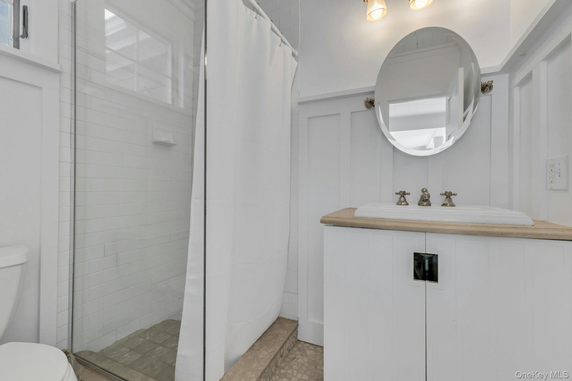 7 Springville Circle Hampton Bays, NY 11946 - Photo 14 of 43 Bathroom with a shower stall and vanity