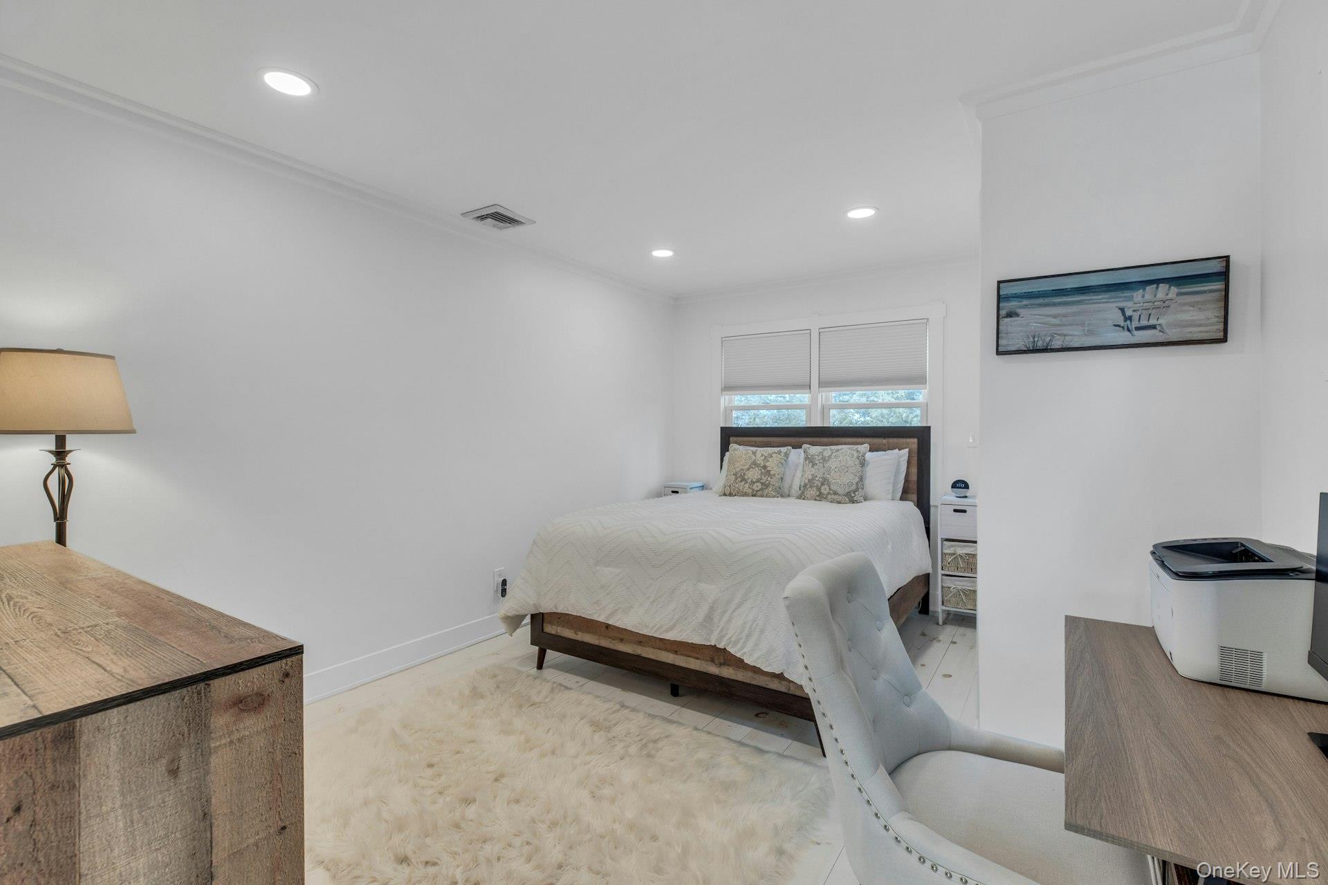 7 Springville Circle Hampton Bays, NY 11946 - Photo 20 of 43 Bedroom with recessed lighting and crown molding