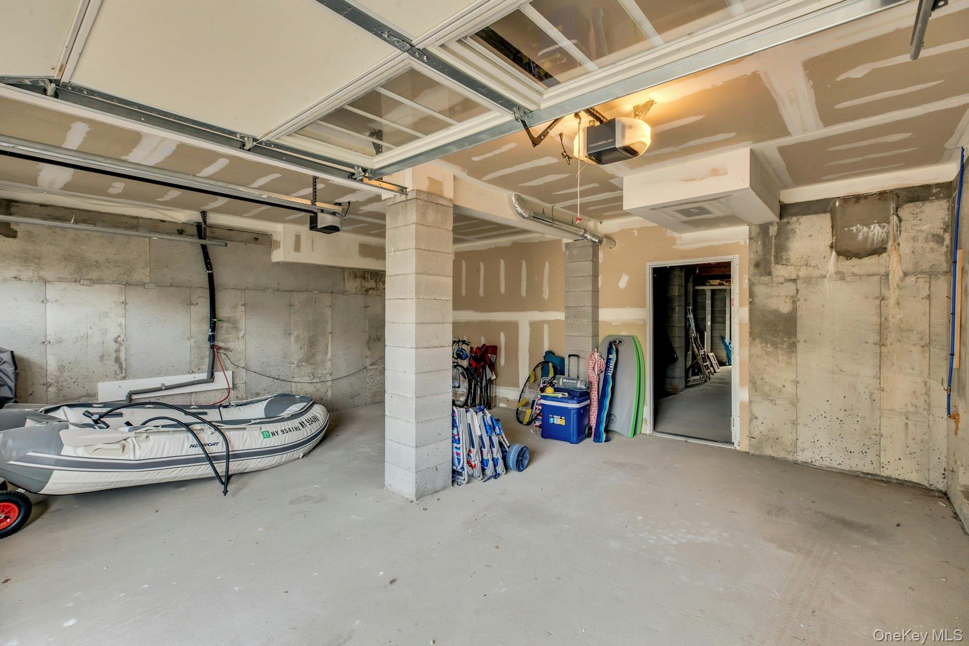 7 Springville Circle Hampton Bays, NY 11946 - Photo 25 of 43 Garage with a garage door opener