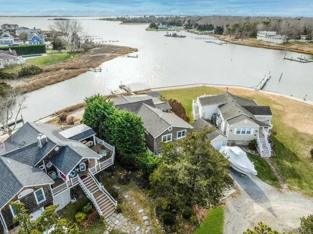 an aerial view of a house with a lake view