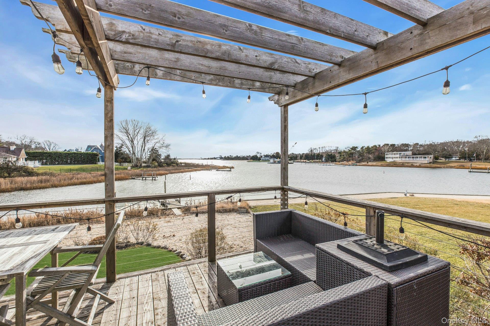 7 Springville Circle Hampton Bays, NY 11946 - Photo 38 of 43 Wooden deck with a water view and an outdoor living space