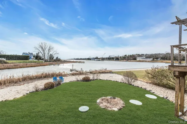 a view of a lake with furniture