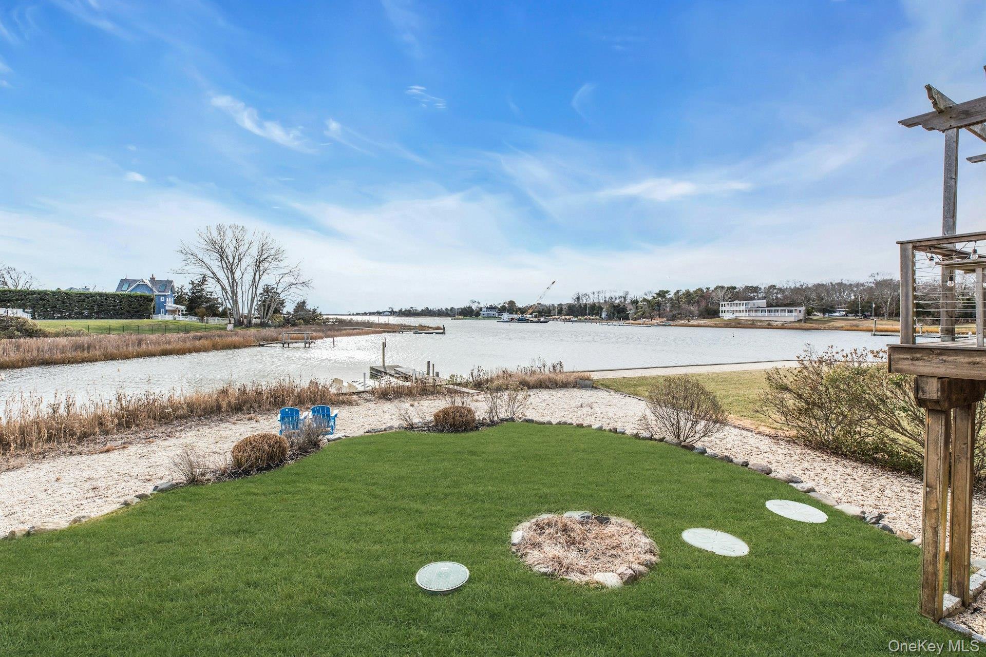 7 Springville Circle Hampton Bays, NY 11946 - Photo 39 of 43 View of green lawn with a water view