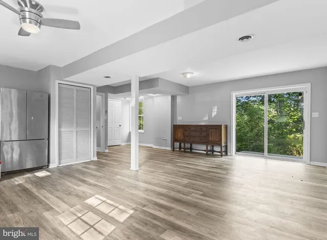 a view of livingroom with furniture a fireplace and wooden floor