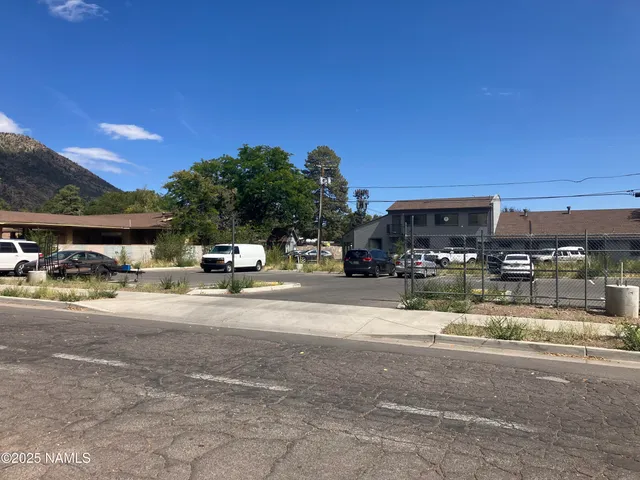 a play ground with potted plants in front of it