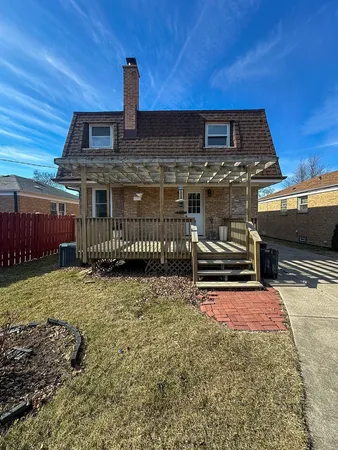a backyard of a house with barbeque oven