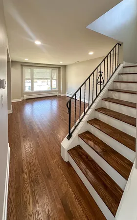 a view of staircase and wooden floor