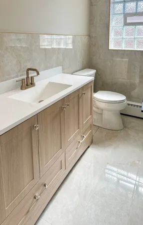 a bathroom with a sink and toilet