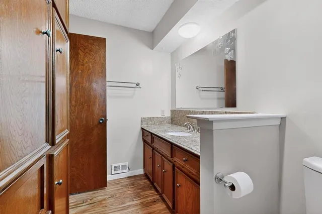 a bathroom with a double vanity sink and mirror