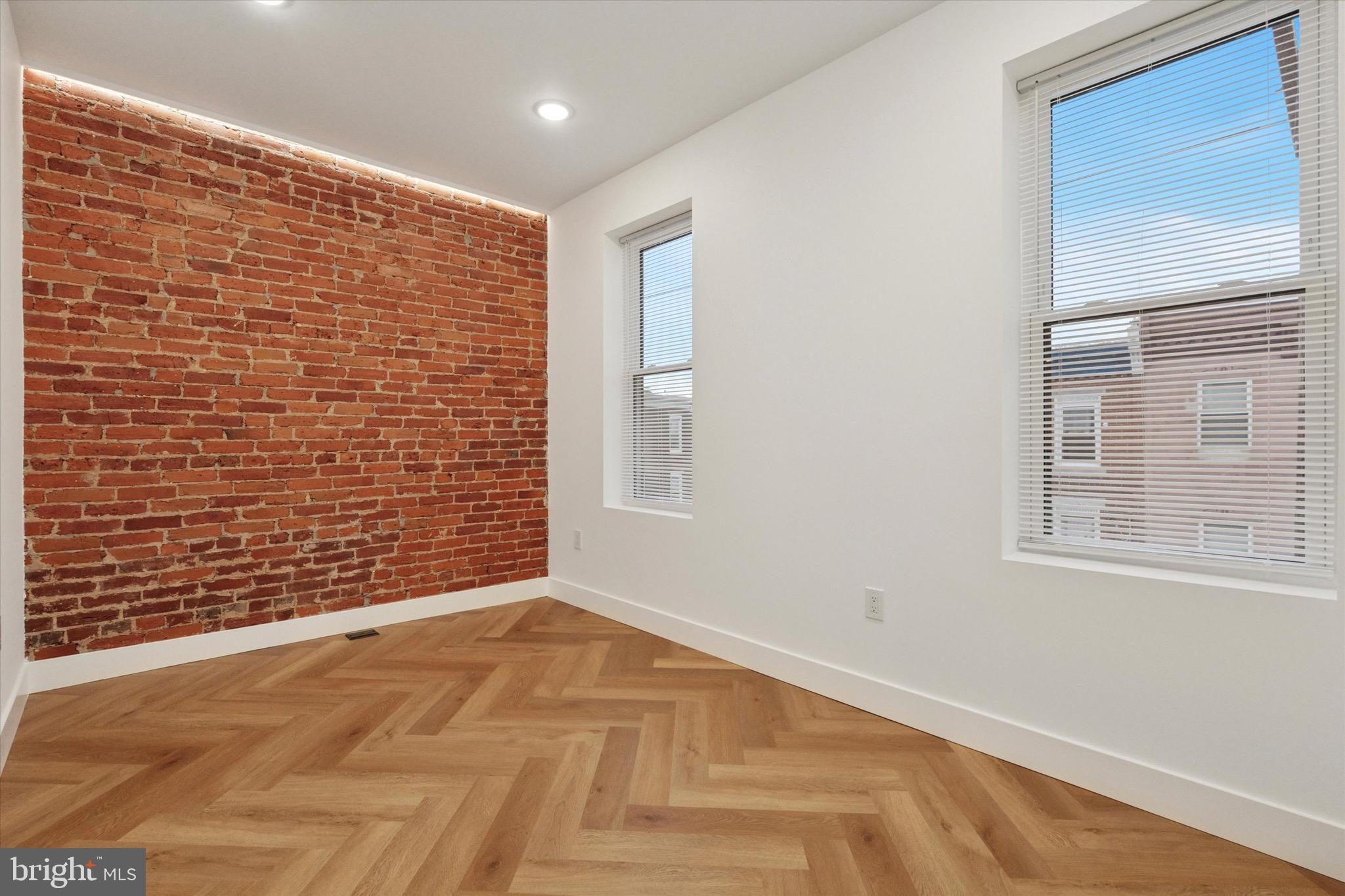 1438 Tasker Street, Unit 3 Philadelphia, PA 19145 - Photo 7 of 9 a view of an empty room with a window