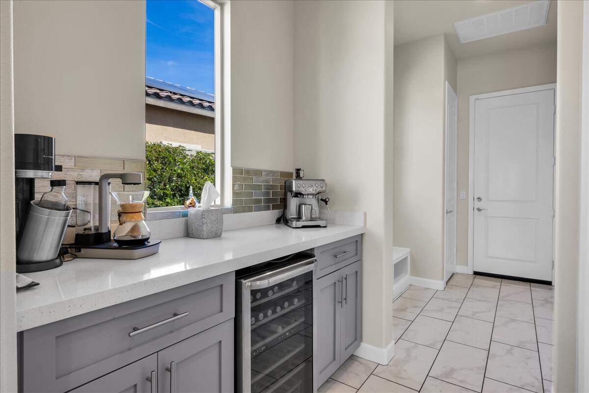 100 Barolo Rancho Mirage, CA 92270 - Photo 23 of 38 a kitchen with a sink and cabinets