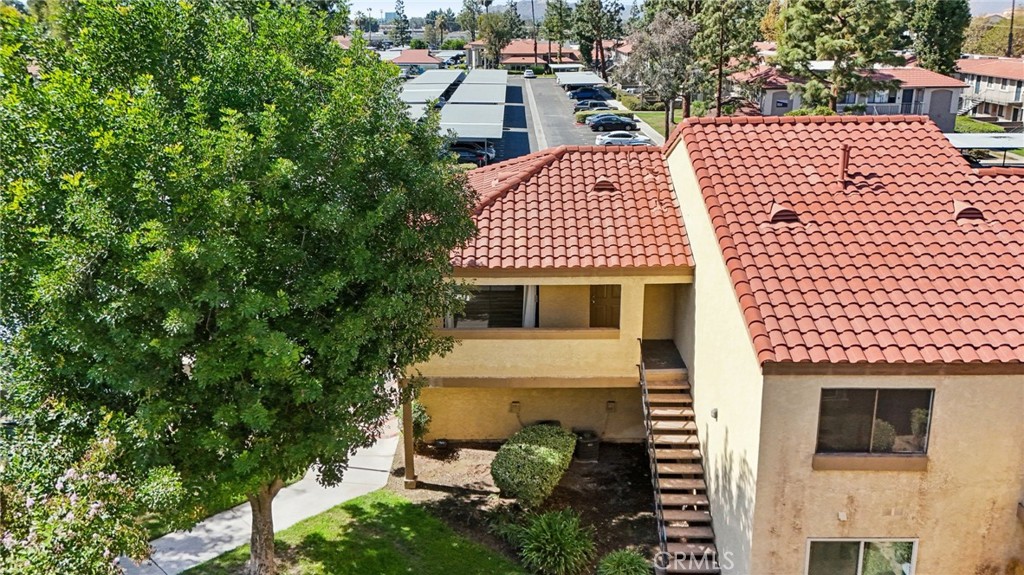 1142 West Blaine Street, Unit 201 Riverside, CA 92507 - Photo 21 of 24 a front view of a house with a garden