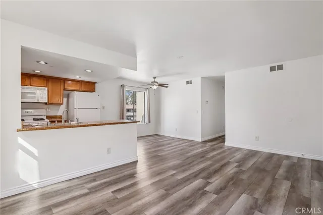 a view of kitchen with wooden floor