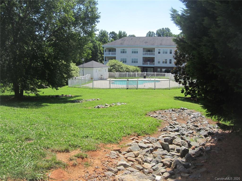 9223 Meadow Vista Road Charlotte, NC 28213 - Photo 13 of 13 a front view of a house with garden