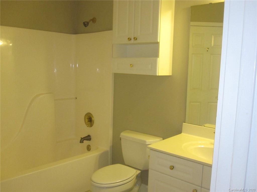 9223 Meadow Vista Road Charlotte, NC 28213 - Photo 8 of 13 a bathroom with a sink a toilet and shower